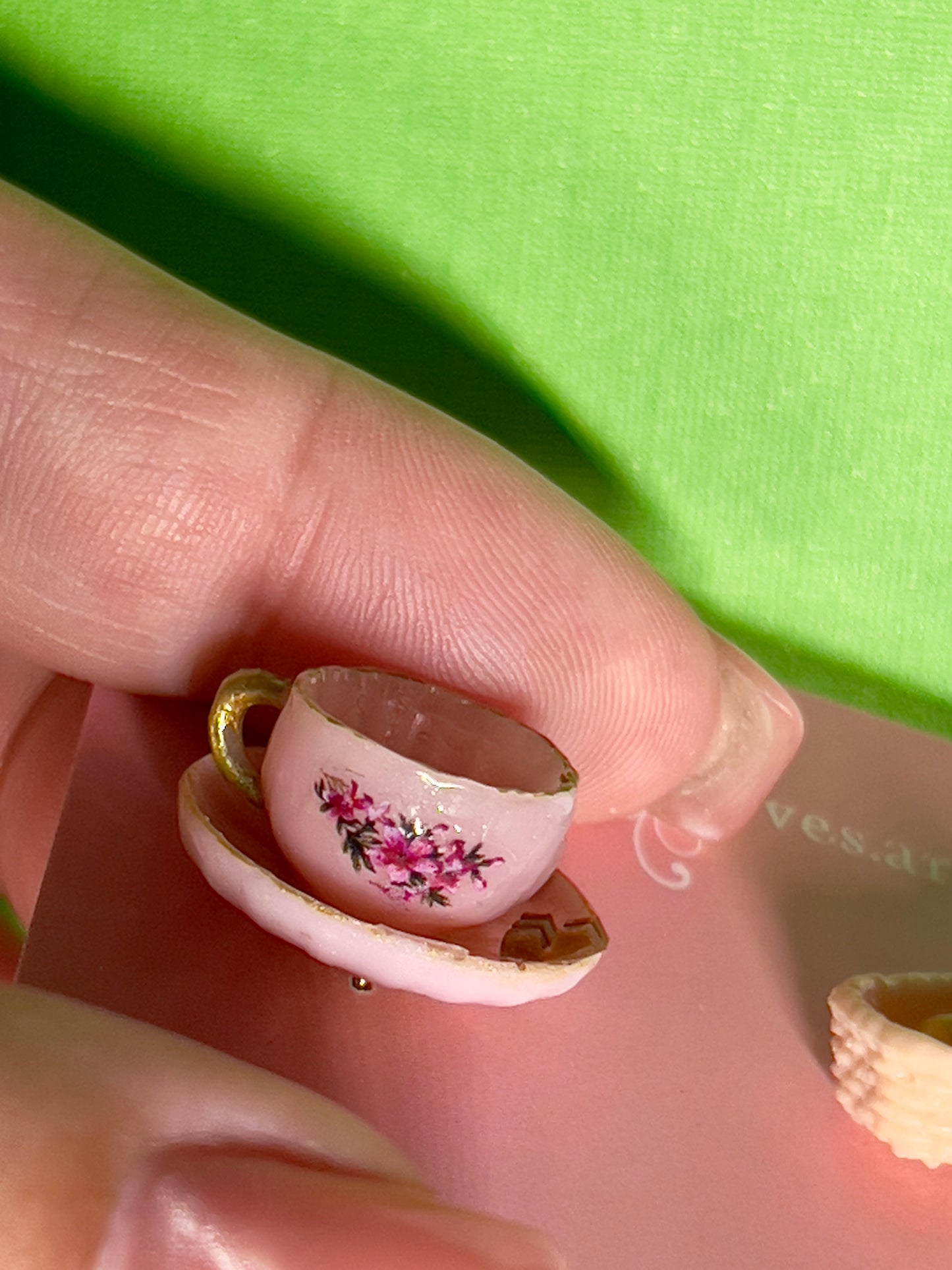 027 - Mini pink teacup and a basket of bread roll