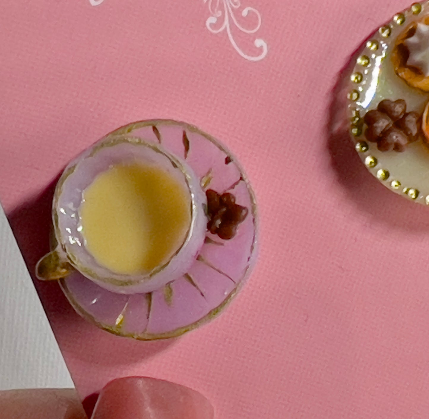 018 - Mini light purple teacup with chocolate and cookies on yellow saucer
