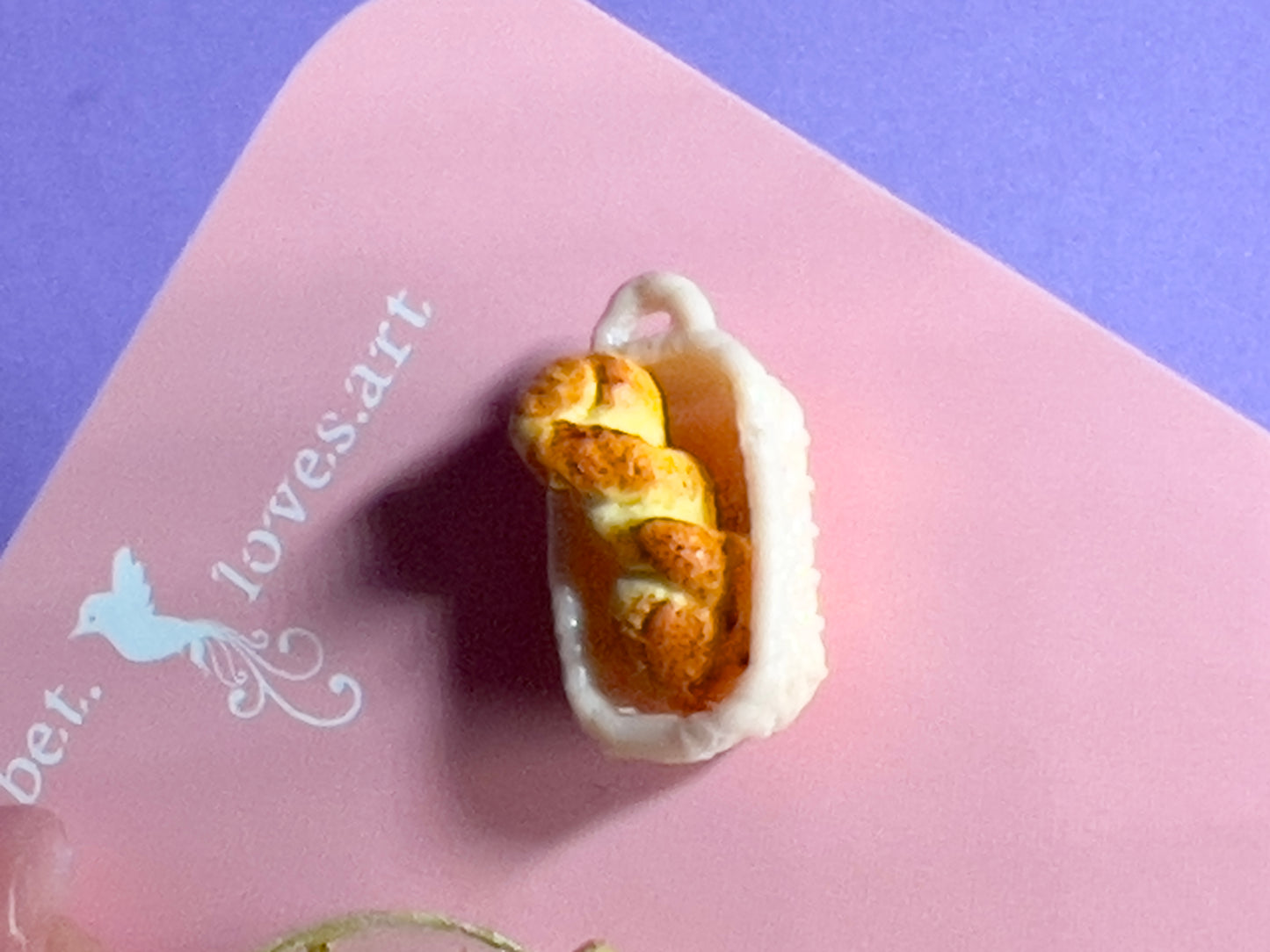 015 - Mini white opaque teacup and a basket of bread