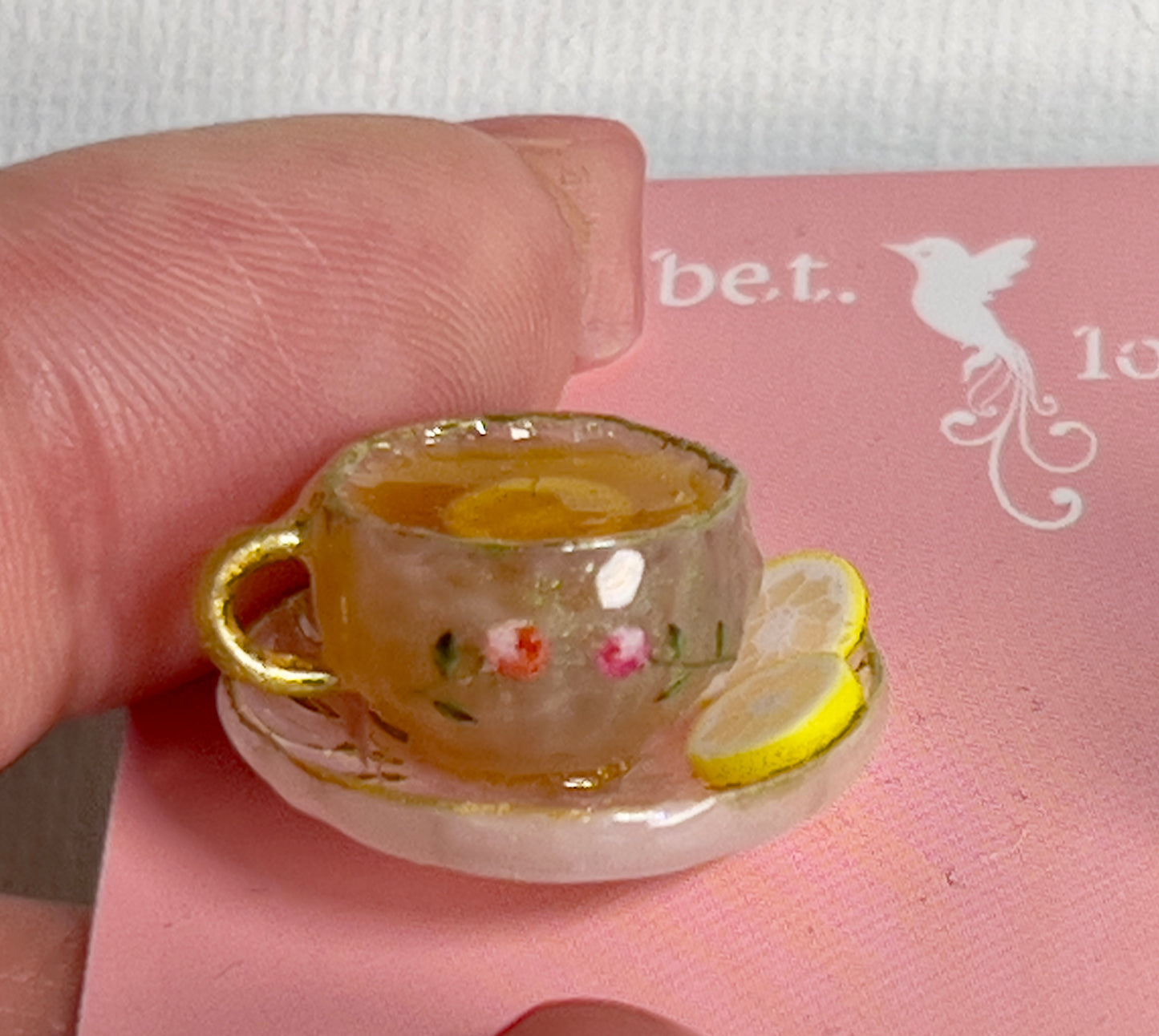 019 - Mini white opaque teacup and a basket of toasts
