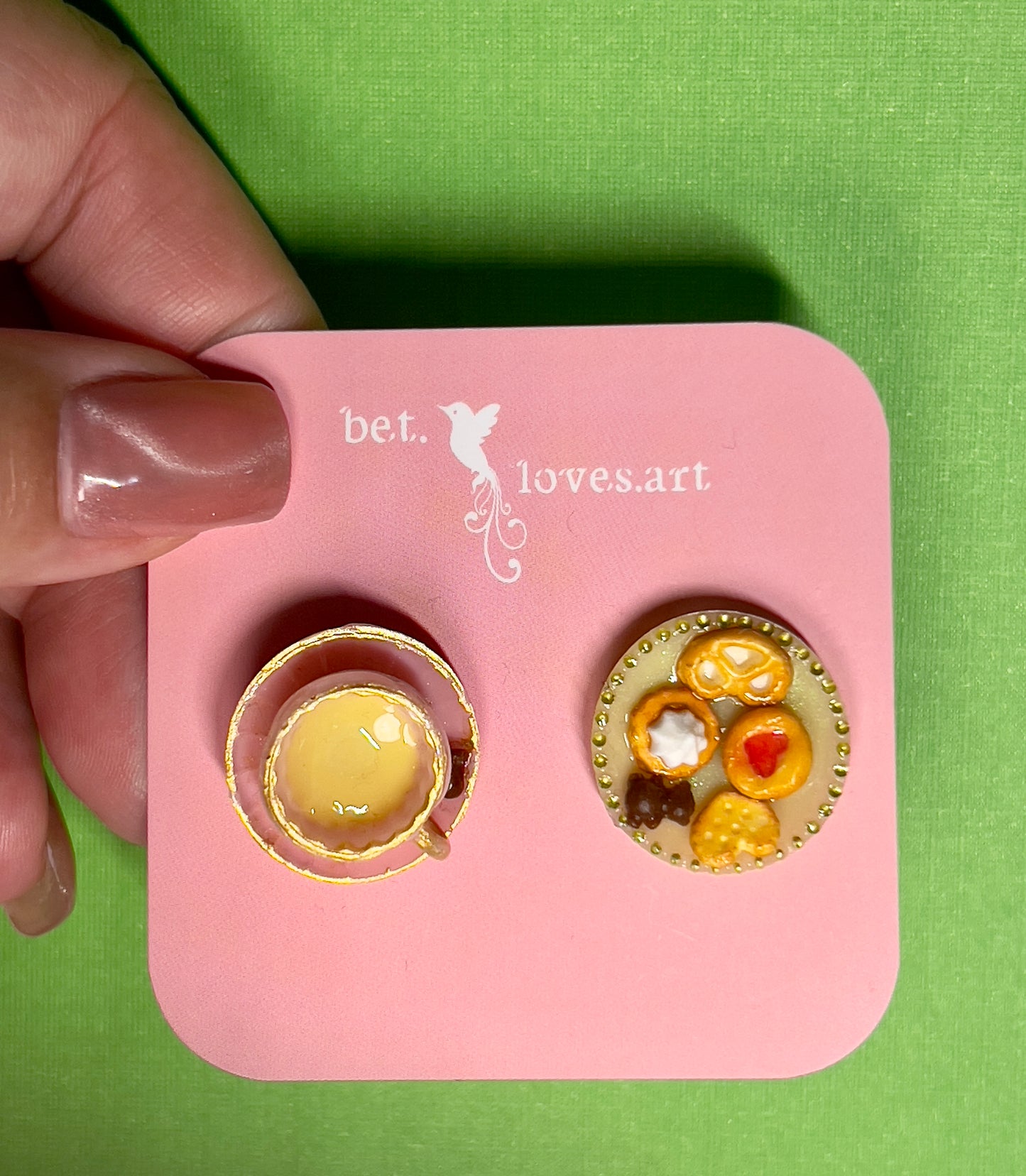 029 - Mini pink teacup and a yellow saucer of cookies