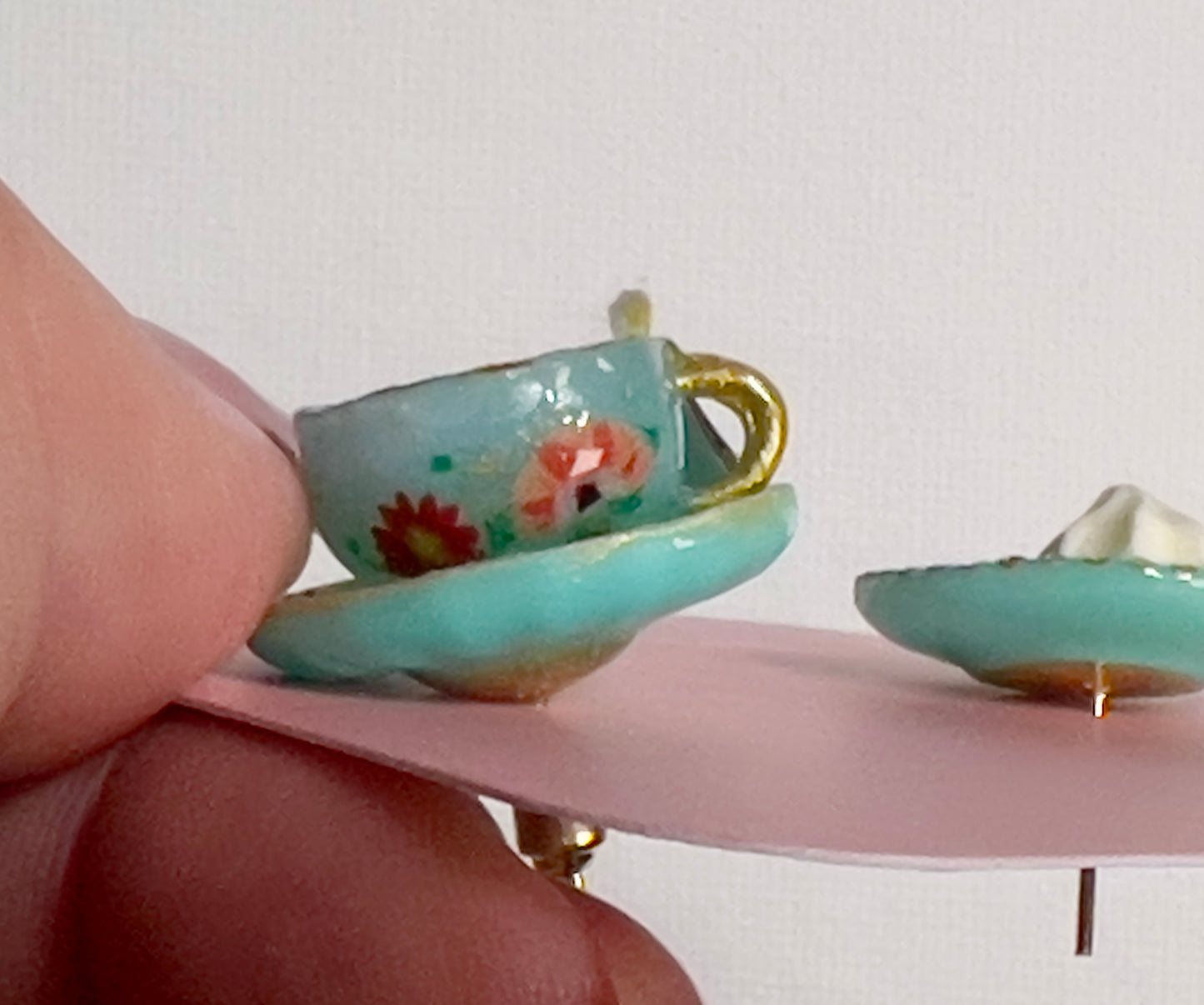 007 - Mini teal teacup with tea bag, teal saucer with palmiers and meringue