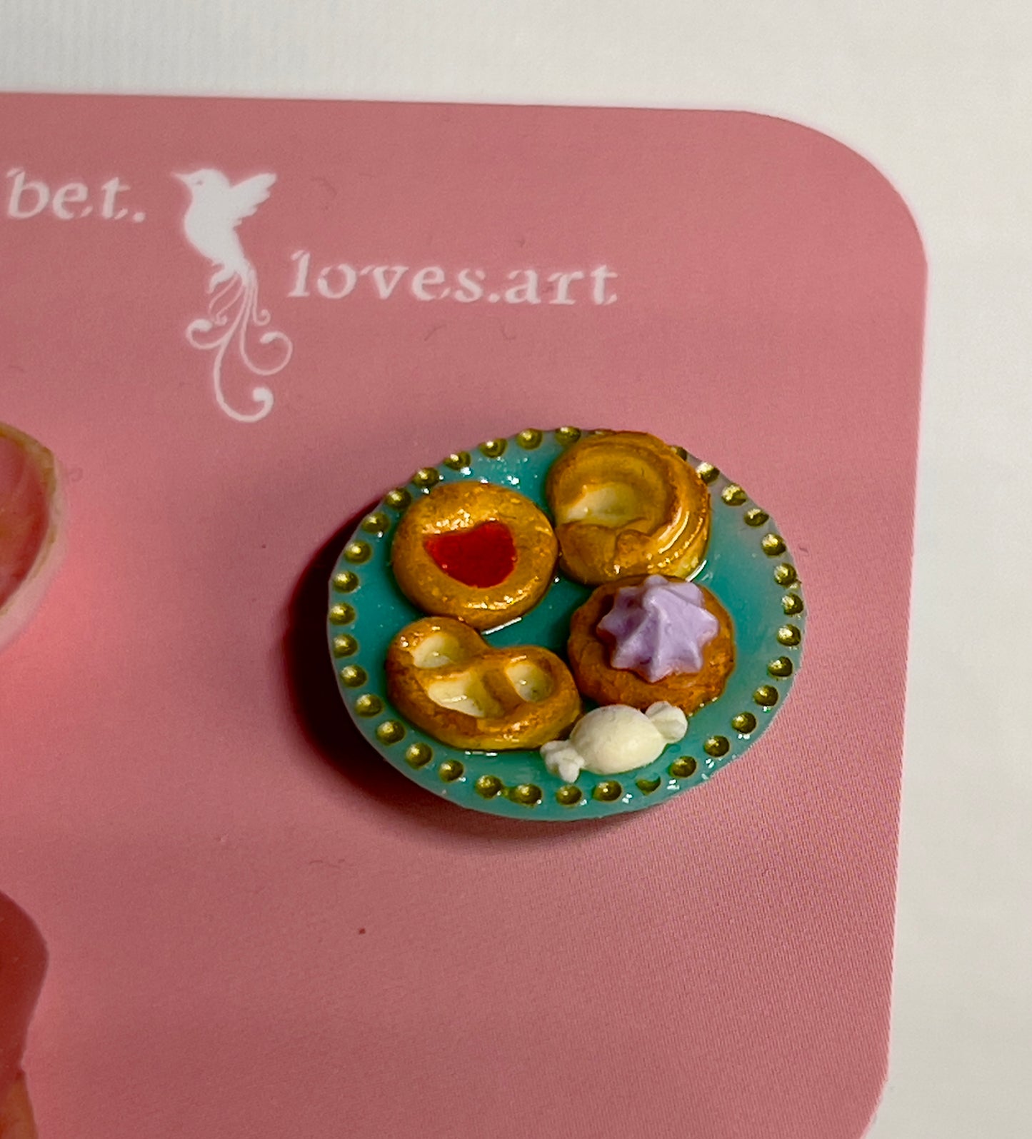 009 - Mini pink teacup with tea bag, cookies on teal saucer