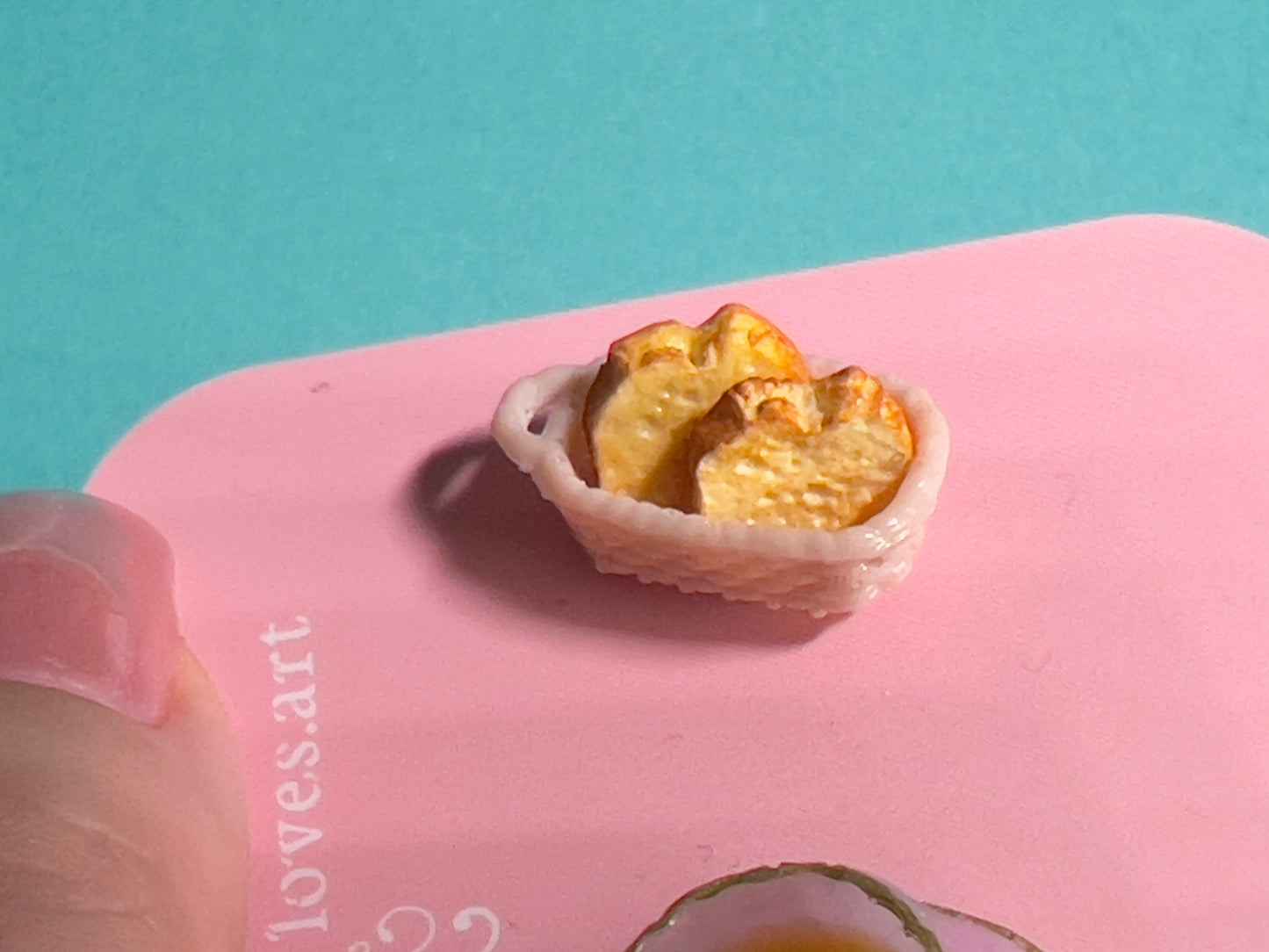 011 - Mini light purple teacup and buttered toasts in basket