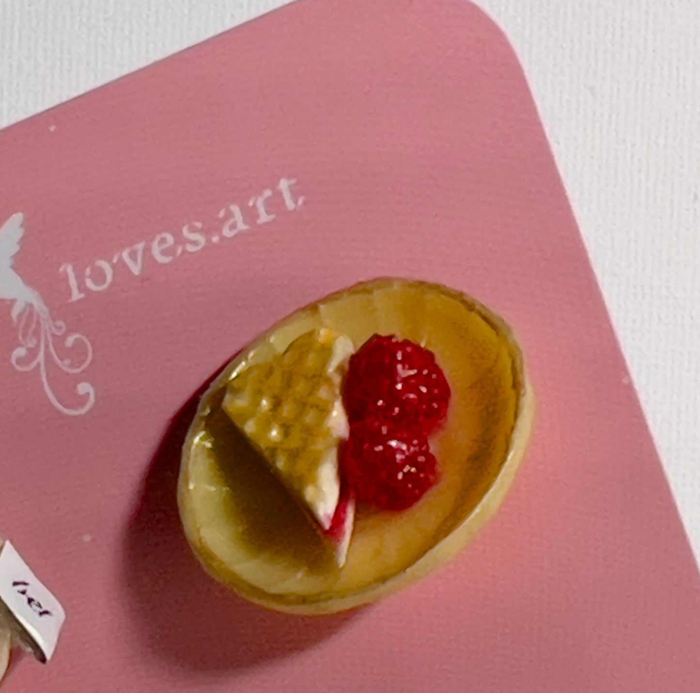 008 - Mini white teacup with tea bag, yellow saucer with waffle and raspberries
