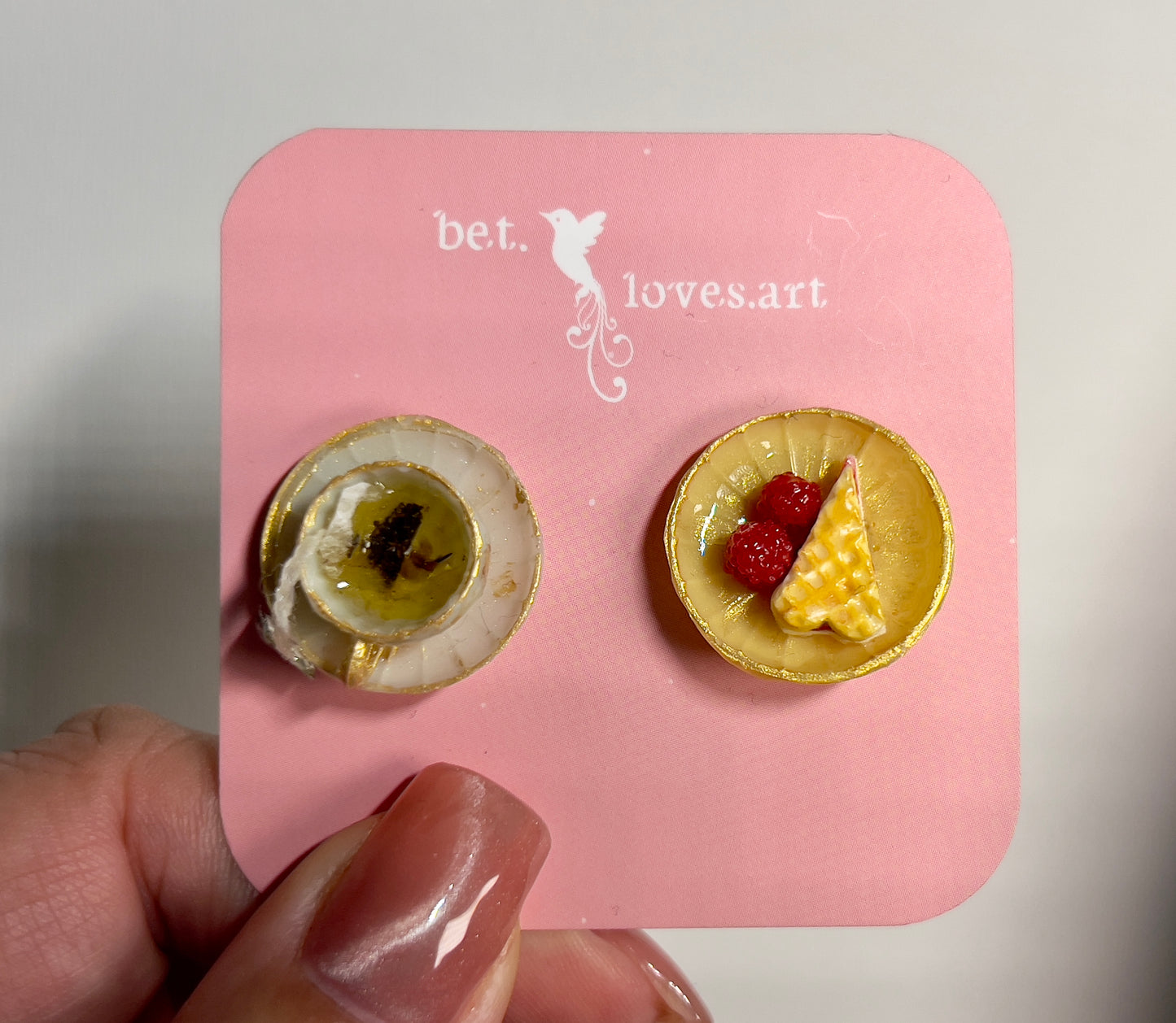 008 - Mini white teacup with tea bag, yellow saucer with waffle and raspberries