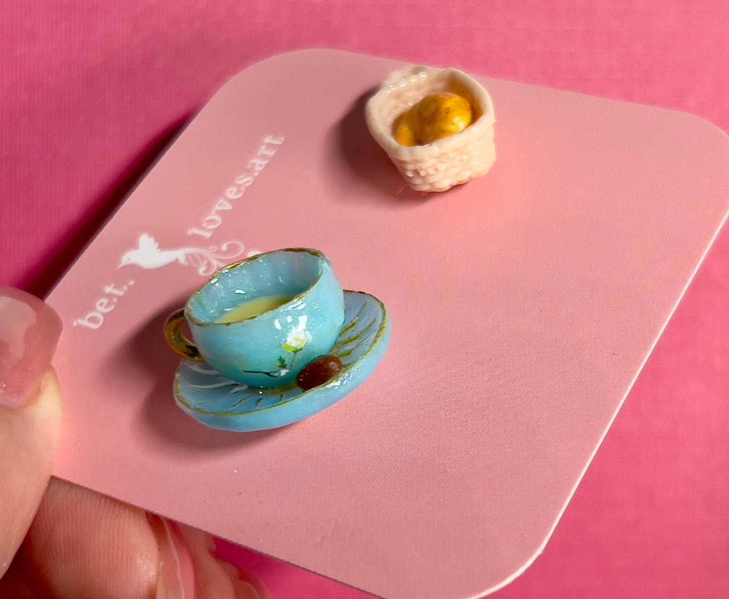 020 - Mini blue teacup and a basket of croissant