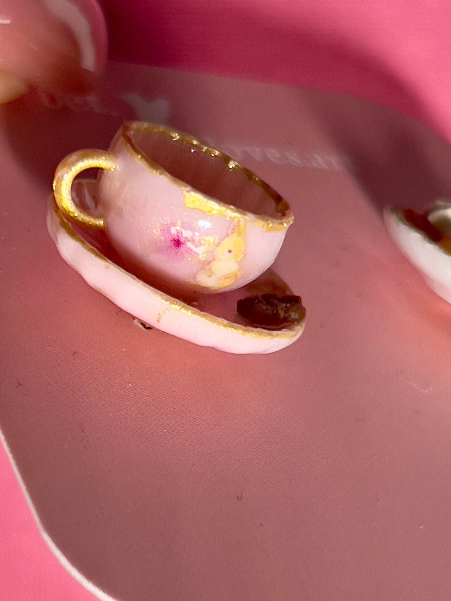 022 - Mini pink teacup and a white saucer of cookies