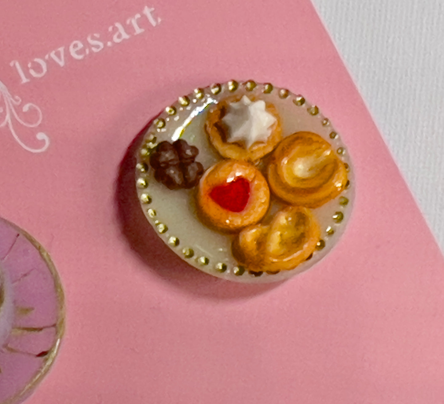 018 - Mini light purple teacup with chocolate and cookies on yellow saucer