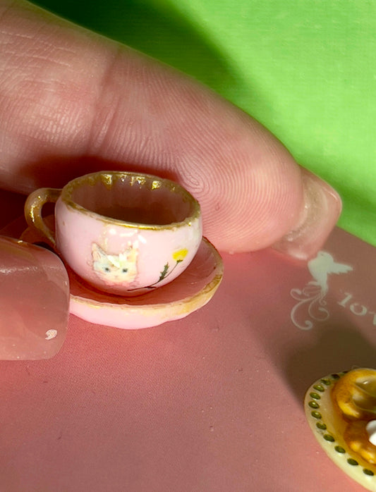 029 - Mini pink teacup and a yellow saucer of cookies