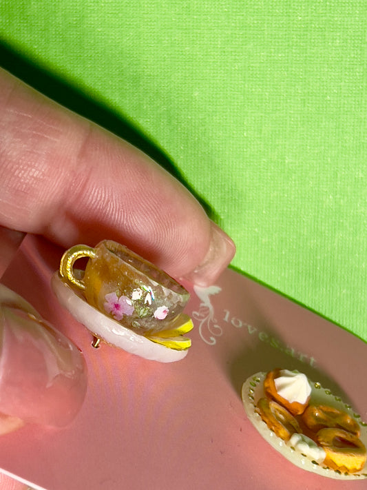 030 - Mini white opaque teacup, white saucer of cookies and white chocolate