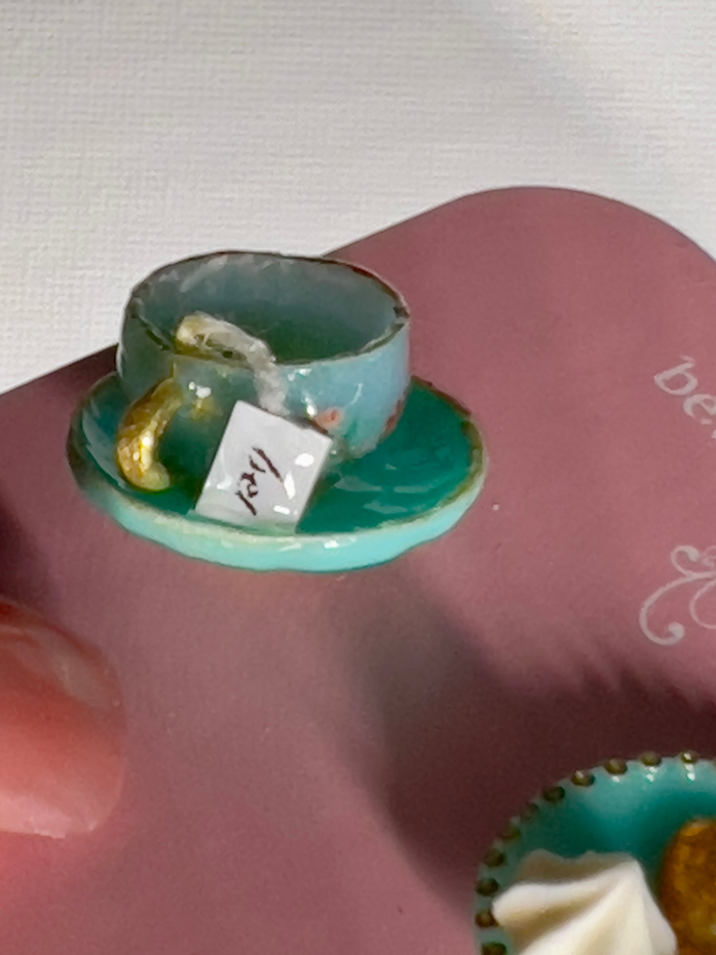 007 - Mini teal teacup with tea bag, teal saucer with palmiers and meringue