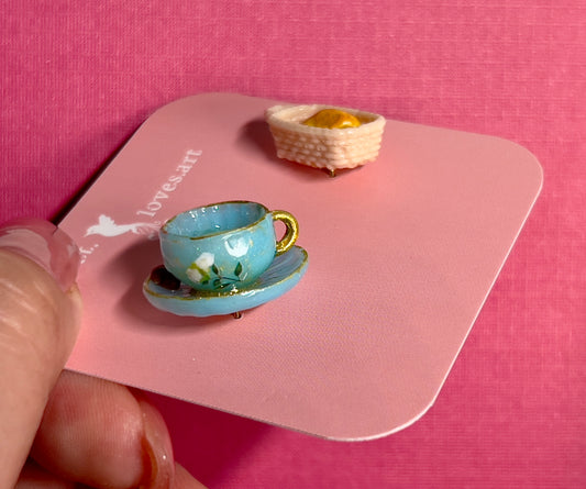 020 - Mini blue teacup and a basket of croissant