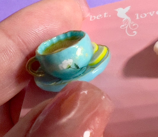017 - Mini teal teacup and a basket of toasts