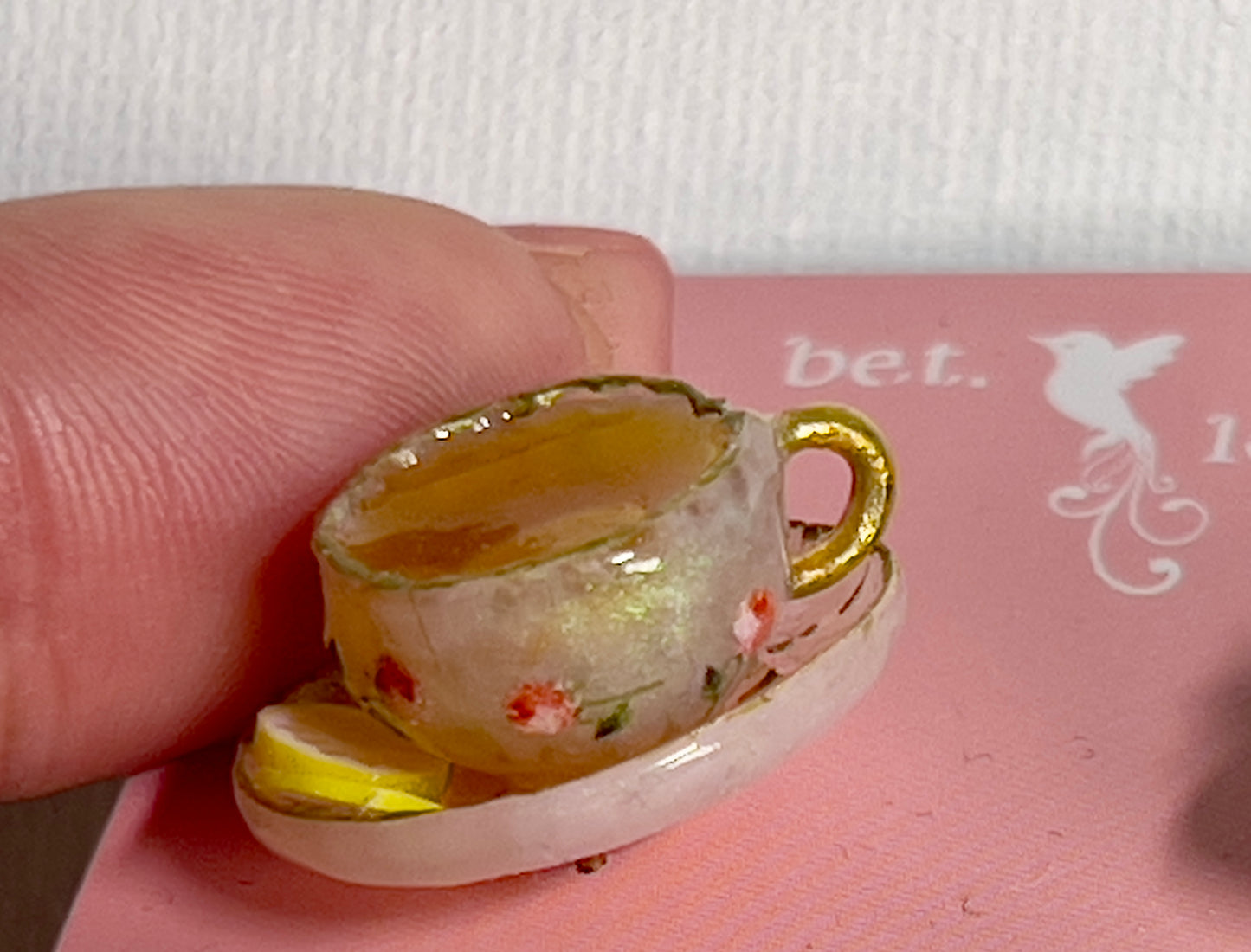019 - Mini white opaque teacup and a basket of toasts